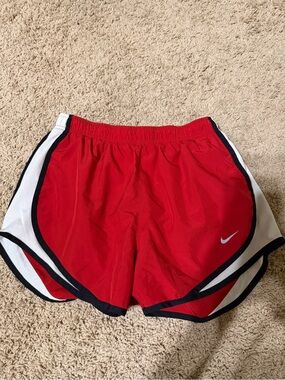 Red Nike Dri fit athletic running shorts